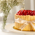 Decorative cake with strawberries on a white plate, featuring the brand 'Melo'.